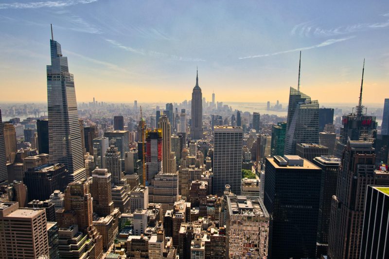 New York City skyline featuring the Empire State Building amid urban architecture.