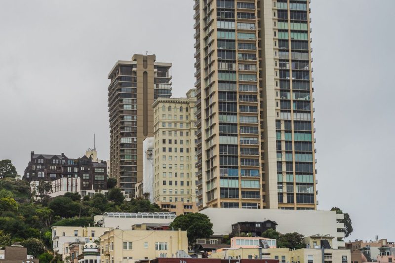 San Francisco skyline showcasing sleek residential towers and contemporary architecture against a clear blue sky.