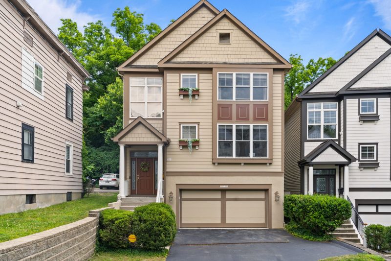 Modern suburban home in Cincinnati, Ohio with a garage and well-maintained garden.